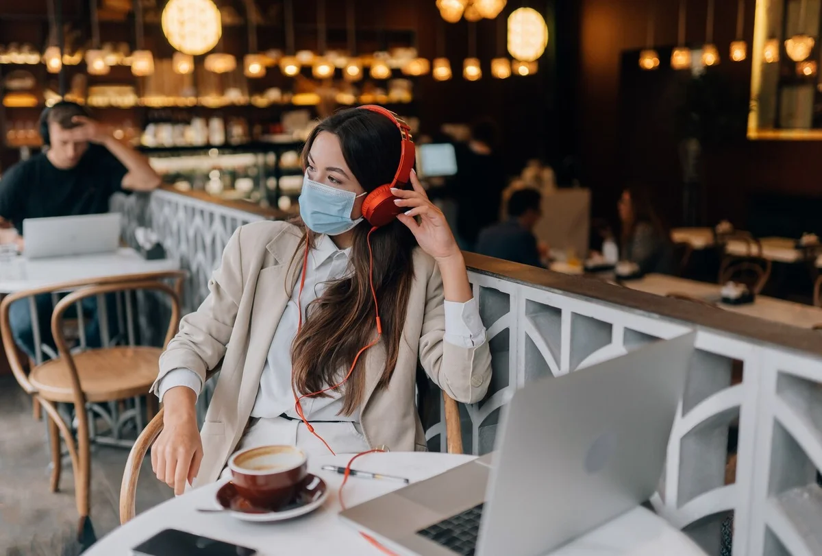 girl-sitting-coffee-shop-with-headphones-coronavirus-outbreak_1153-8412.jpg